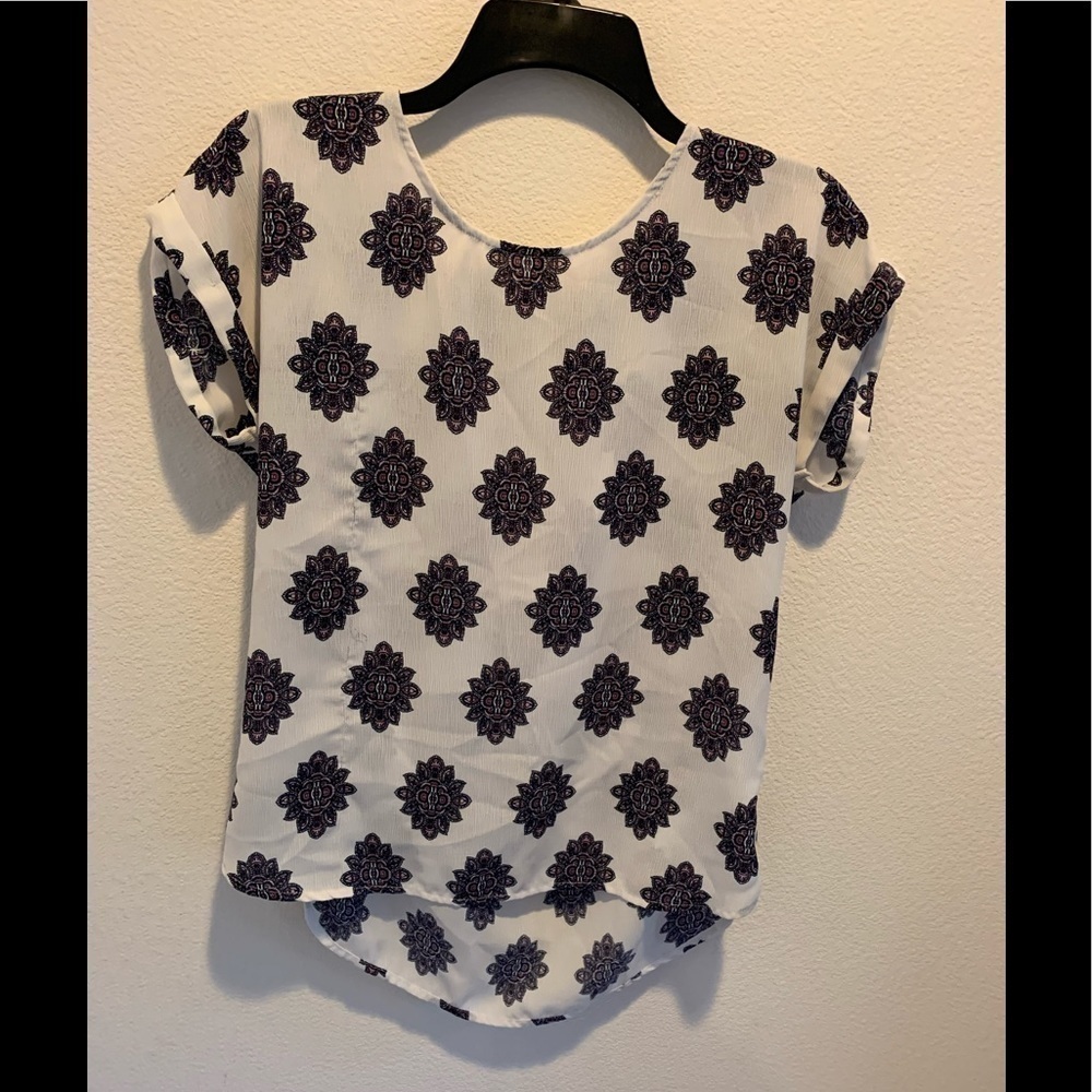 Cute top by Pink Republic with cuffed cap sleeve.​​​​​​​​​​​​​​​​​​​​​​